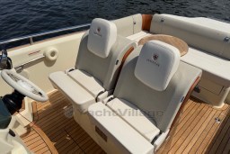 2023 Invictus GT 280 boat interior with luxurious seating and wooden deck.