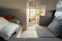 2023 Invictus GT 280 interior showcasing cozy cabin with bed and seating area.