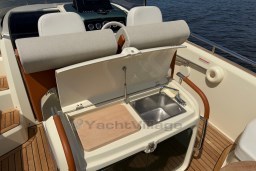 2023 Invictus GT 280 boat interior with sink and cutting board on deck.