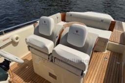 2023 Invictus GT 280 boat interior with luxurious seating and wooden deck.