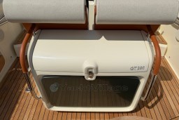 2023 Invictus GT 280 boat interior with cushioned seating and wooden flooring.