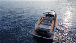 2019 Pardo Yachts 43 cruising on calm blue waters at sunset.