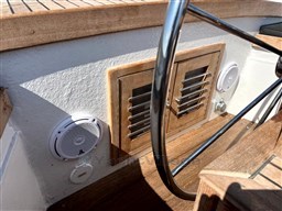 1978 Sloop 785 boat interior with wooden paneling and metal railing.