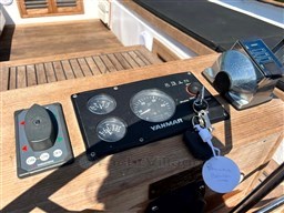 Control panel of a 1978 Sloop 785 sailboat with Yanmar engine gauges and thruster controls.