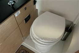 Modern bathroom in 2017 Fjord 36' Open yacht with sleek toilet design.