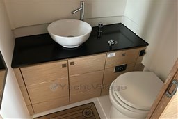 Modern bathroom in 2017 Fjord 36' Open yacht with sleek sink and toilet.