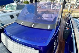 2017 Fjord 36' Open boat with sleek blue design and spacious cockpit.