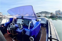 2017 Fjord 36' Open boat with modern cockpit and marina view.
