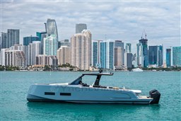 2026 Pardo Yachts P43R cruising in front of a city skyline on a clear day.
