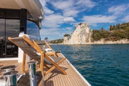 Luxury Pardo Yachts Endurance 60 on serene waters, 2025 model, with scenic coastal view.