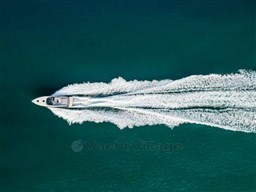 Aerial view of 2025 VanDutch 56 yacht cruising on open water.