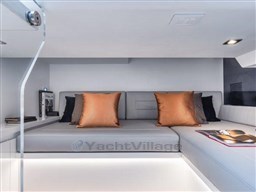 Luxurious interior of 2025 VanDutch 56 yacht with modern seating and elegant cushions.