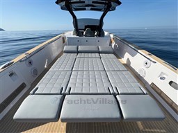 2023 Pardo Yachts 38 with spacious sunbed on open deck, cruising on calm sea.