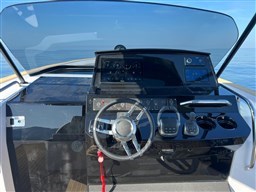 Cockpit of 2023 Pardo Yachts 38, featuring modern steering and navigation controls.