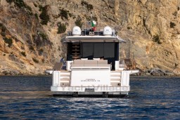 2025 Pardo Yachts Endurance 72 cruising near rocky coastline.