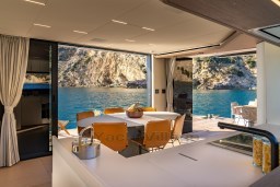 Luxurious interior of 2025 Pardo Yachts Endurance 72 with ocean view and modern dining area.