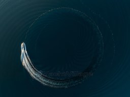 Aerial view of 2025 Pardo Yachts Endurance 72 making a circular wake in deep blue water.