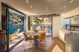 Luxurious interior of 2025 Pardo Yachts Endurance 72 with dining area and scenic ocean view.