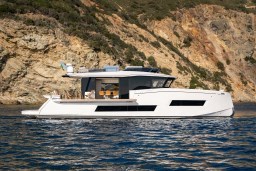 2025 Pardo Yachts Endurance 72 cruising near rocky coastline.