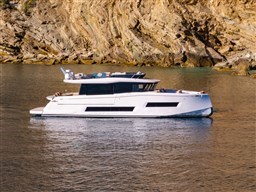 2025 Pardo Yachts Endurance 72 cruising near rocky coastline.