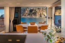 Luxurious interior of 2025 Pardo Yachts Endurance 72 with ocean view and elegant dining area.