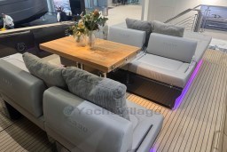 Luxurious seating area on 2026 Pardo Yachts 43, featuring elegant cushions and a wooden table.