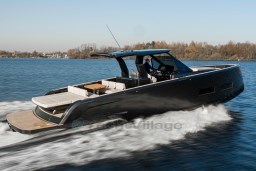 2026 Pardo Yachts 43 cruising on a serene lake under clear skies.