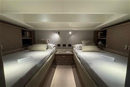 Luxurious twin cabin interior of 2026 Pardo Yachts 43, featuring elegant bedding and modern design.