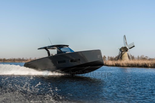 2026 Pardo Yachts 43 cruising on water near a windmill.