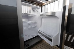 Open refrigerator on 2026 Pardo Yachts 43, showcasing spacious interior and shelving.