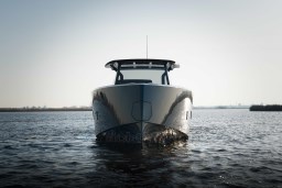 Front view of 2026 Pardo Yachts 43 on calm water under clear sky.