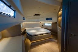 Luxurious interior cabin of 2026 Pardo Yachts 43, featuring a spacious bed and modern design.