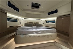Luxurious cabin interior of 2026 Pardo Yachts 43, featuring elegant bedding and modern design.