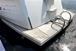 Stern view of 2012 Corsiva 690 Tender with swim platform and ladder.