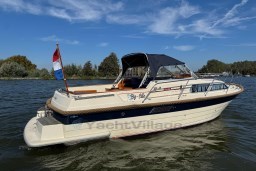 2008 INTER 9000 Sportivo boat on a sunny day, featuring a Dutch flag.