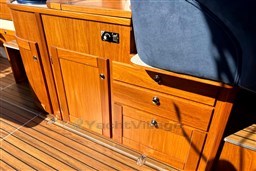 Wooden cabinetry and seating on a 2008 INTER 9000 Sportivo boat interior.