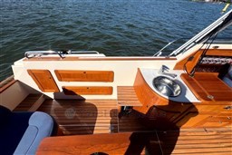 Luxury boat interior with wooden deck, sink, and storage compartments on a 2008 INTER 9000 Sportivo.