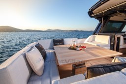 Luxurious 2025 Pardo Yachts GT 52 with elegant outdoor seating and scenic ocean view.
