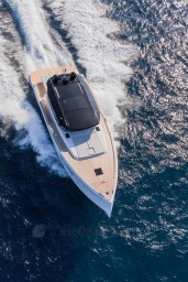 2025 Pardo Yachts GT 52 cruising on open water, aerial view.