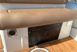 2026 Brig Eagle 8 boat interior with cushioned seating and built-in storage compartment.