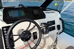 Steering console of 2026 Brig Eagle 8 boat with navigation system and controls.