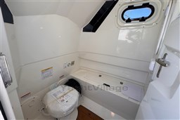 Interior of 2026 Brig Eagle 8 boat cabin with window and storage.