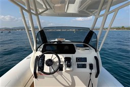 2026 Brig Eagle 8 boat dashboard with steering wheel, controls, and sea view.