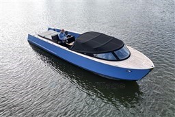 Isloep Rapida 990 boat, 2010 model, cruising on calm water with a sleek blue design.