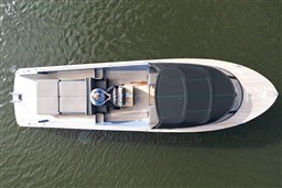 Overhead view of 2010 Isloep Rapida 990 boat on water, featuring sleek design and spacious deck.
