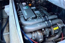 Engine of 2010 Isloep Rapida 990 boat, showcasing mechanical components and details.