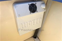 Waeco cooling unit inside 2010 Isloep Rapida 990 boat, featuring a fan and control knob.