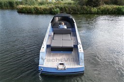 Isloep Rapida 990 boat cruising on a calm river, 2010 model.