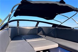 2010 Isloep Rapida 990 boat interior with cushioned seating and canopy.