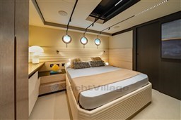 Luxurious bedroom interior of 2025 VanDutch 75 yacht with modern design and ambient lighting.